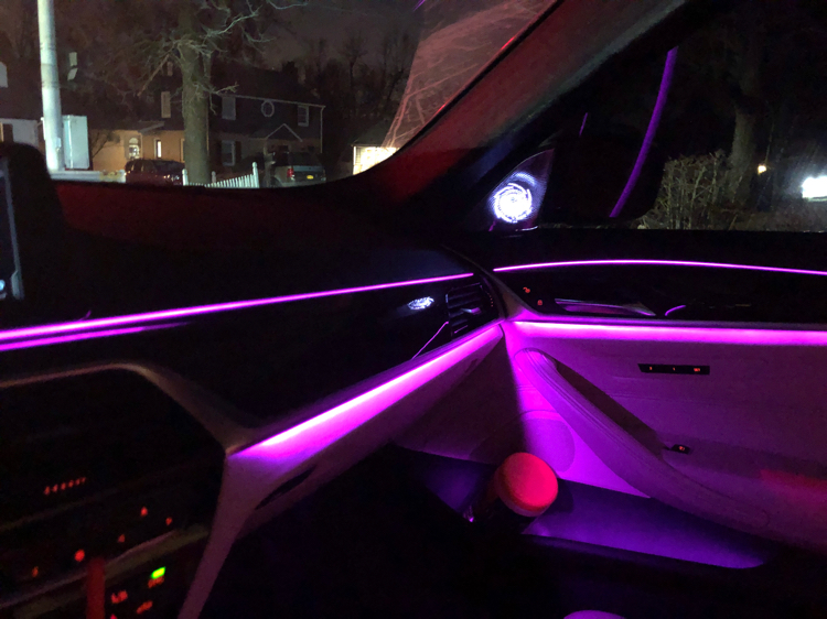 Custom vehicle interior with purple ambient lighting